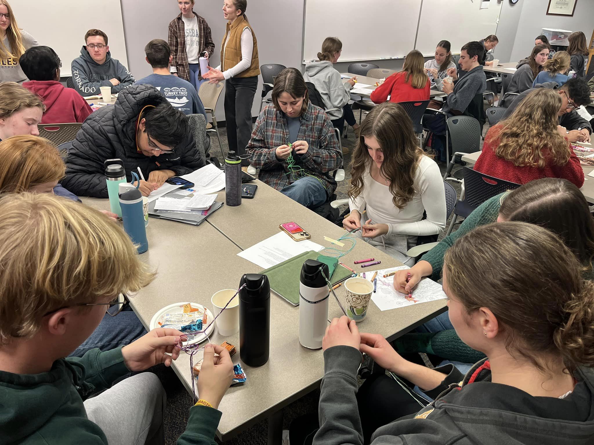 Honors student board members at a table in Jischke Honors Building.