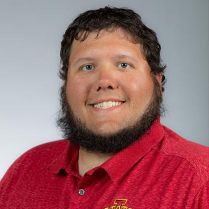 Nate Dobbels in a red ISU polo.