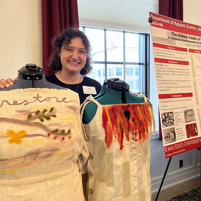 Female honors student presenting her honors project at the poster session.